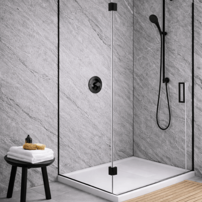 A rendered bathroom featuring grey marble-look wall panels in a walk-in shower, with black shower fixtures, a frameless glass screen, a white shower tray, and a small stool holding folded towels. This image is an AI-generated render.